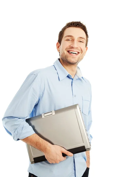 Młody student z laptopa uśmiechający się — Zdjęcie stockowe