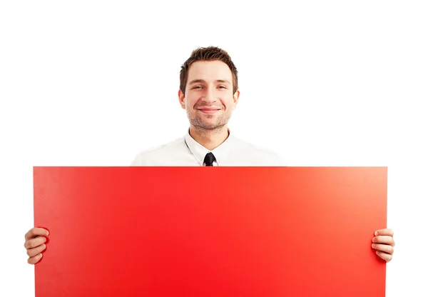 Proud businessman behind red sign — Stock Photo, Image