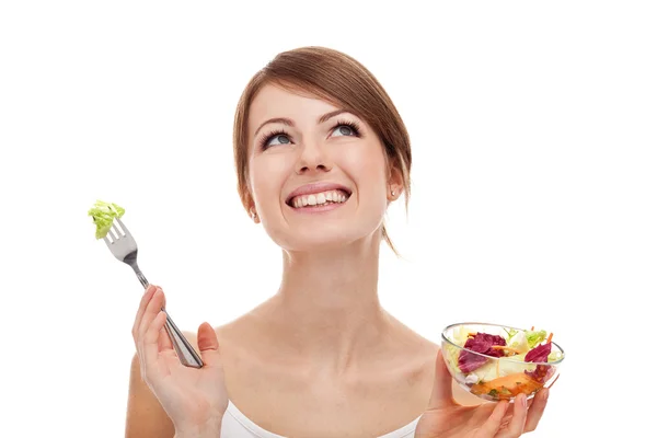 Woman with salad looking up. Stock Image