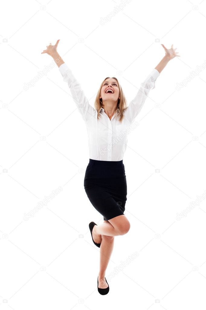 Pretty young woman with arms raised isolated