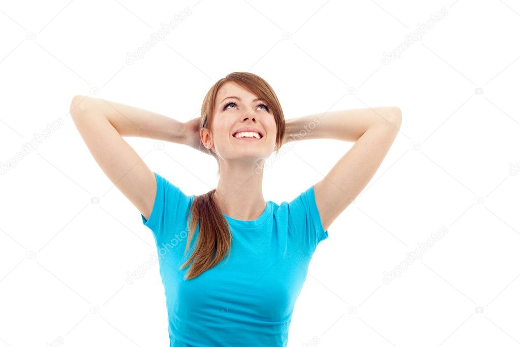 Happy woman with hands behind her head