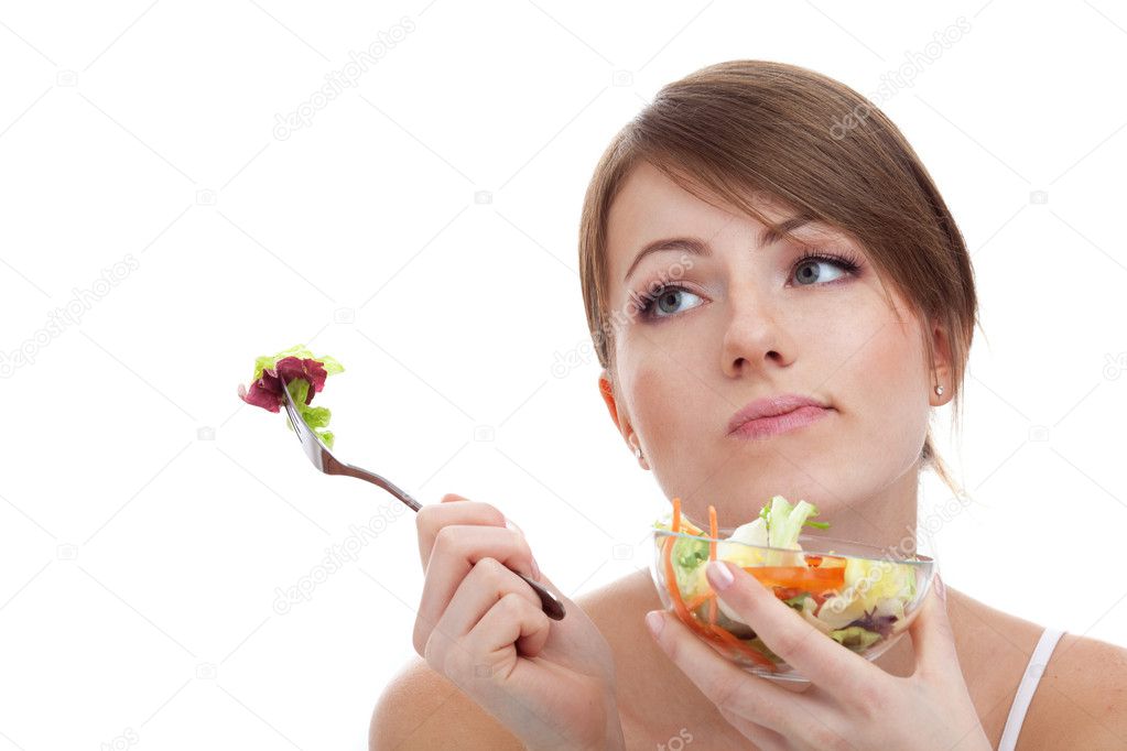Sad woman on diet with vegetables