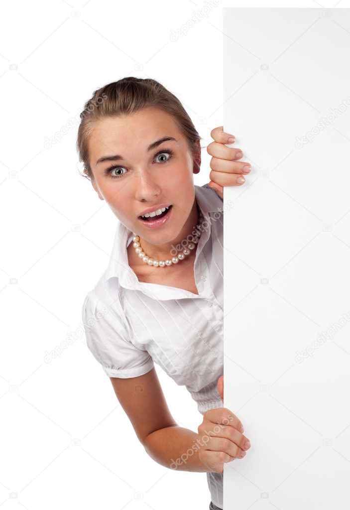 Surprised young woman holding board