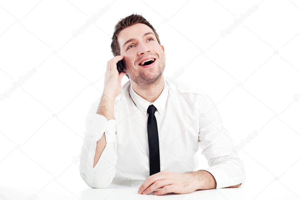 Happy businessman talking by phone