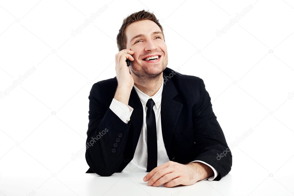 Happy businessman with mobile phone