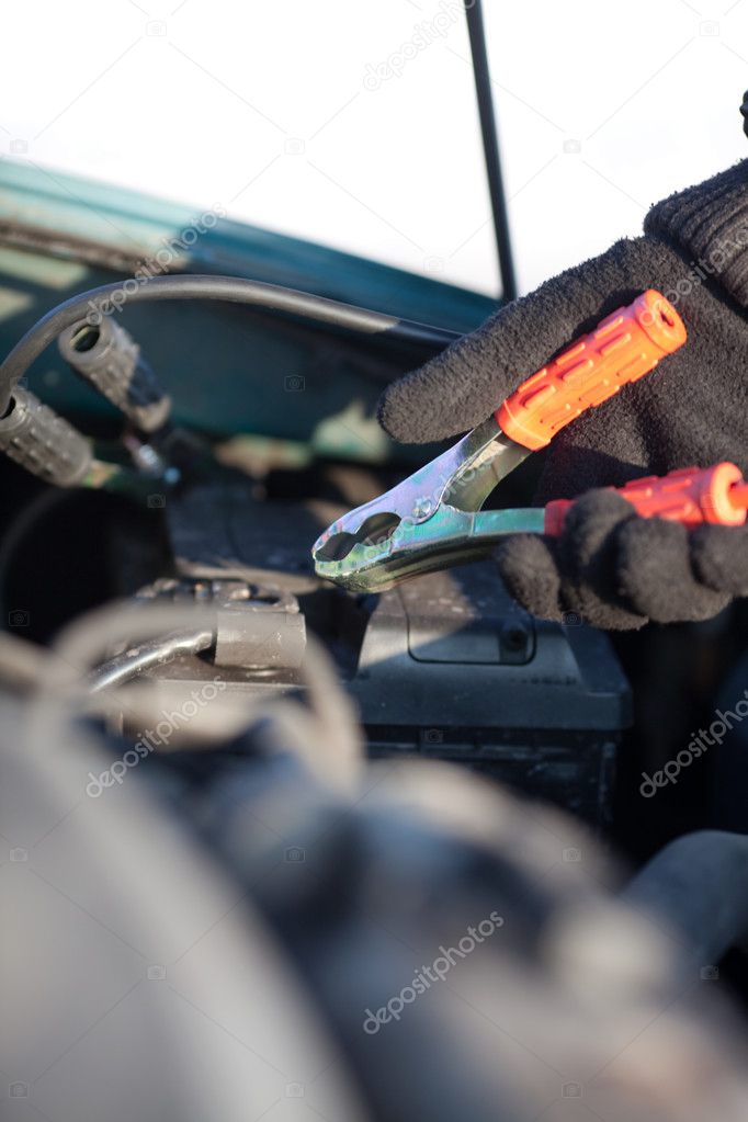 Connecting jumper cable to battery