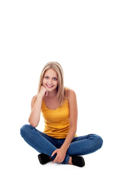 Young woman sitting isolated — Stock Photo, Image