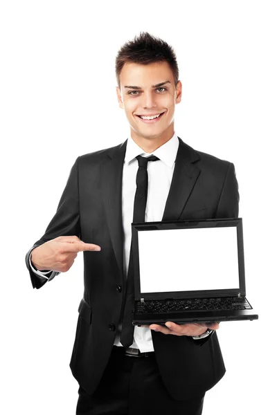 Stilig affärsman pekar på laptop — Stockfoto