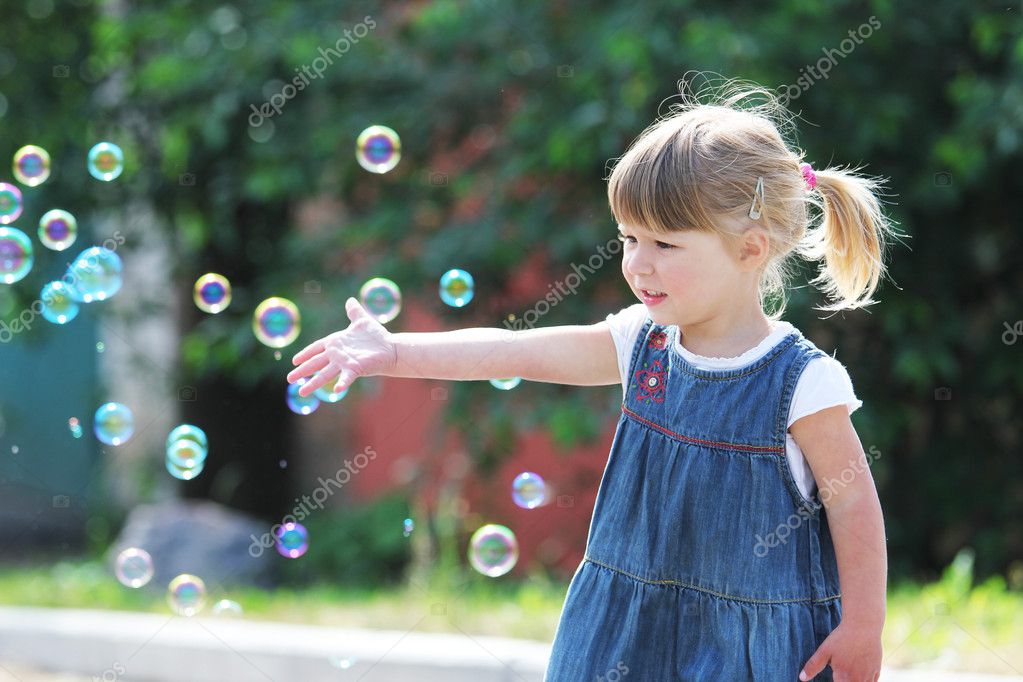 A beautiful little girl in the rain — Stock Photo © Kostia777 #11301837