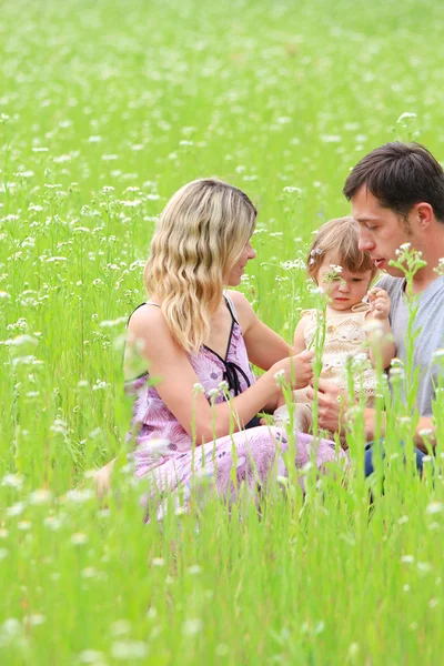 Young family in nature — Stock Photo, Image