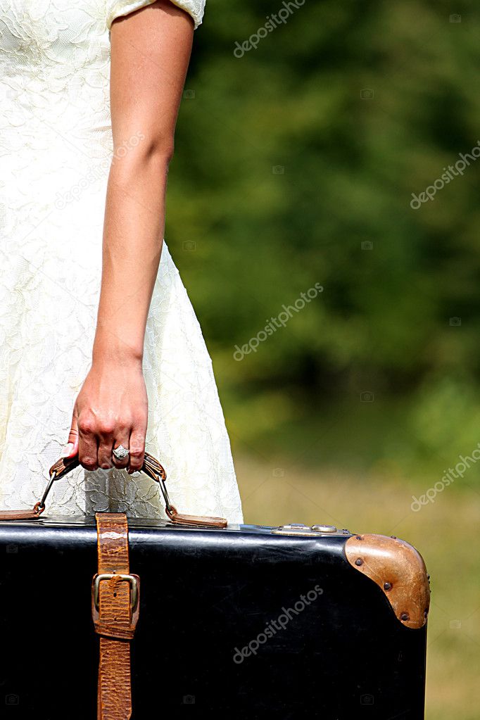 Hand with a suitcase
