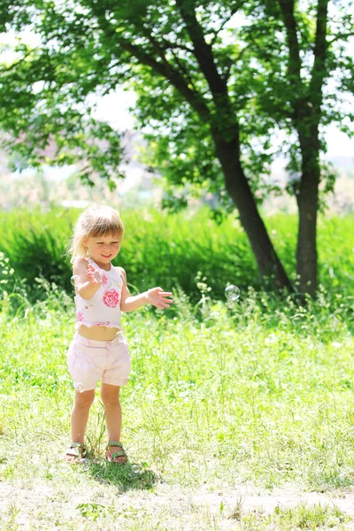 A beautiful little girl on the nature — Stock Photo, Image