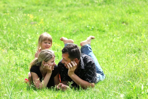 A young family on the field — Stock Photo, Image