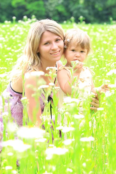 Mother and daughter on the field — Stock Photo, Image