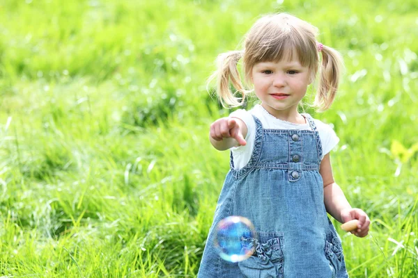 A beautiful little girl on the nature — Stock Photo, Image