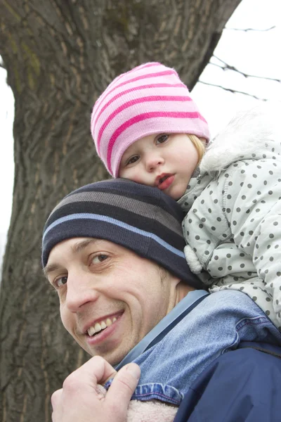 Family in the park in winter — Stock Photo, Image