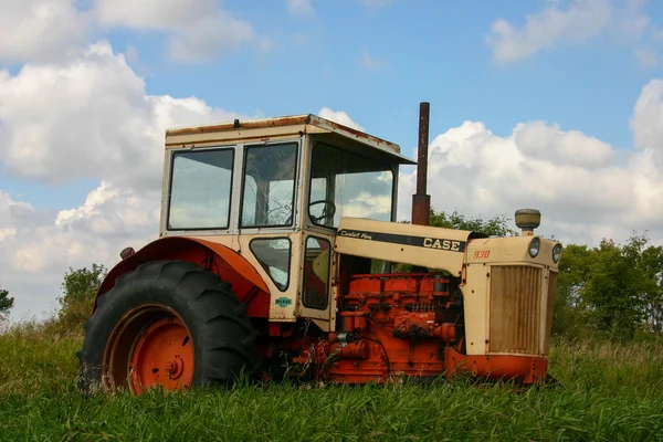 Broken Down tractor in a field. Royalty Free Stock Photos