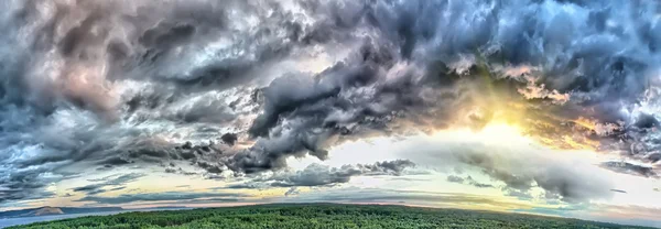 stock image Storm dark clouds over forest