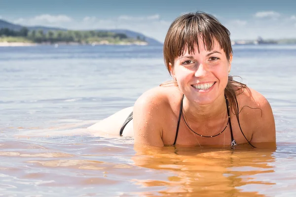 stock image The girl lay in the water