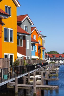 Colored houses near the water clipart