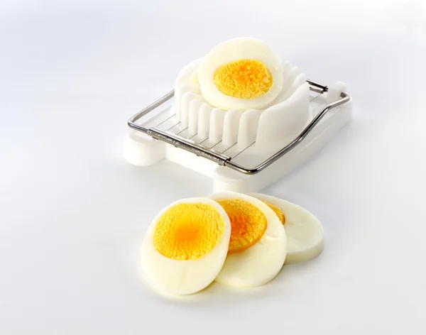 An egg slicer and sliced ​​egg