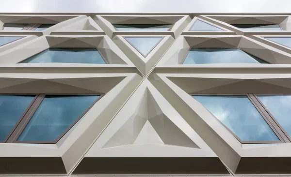 Modern facade of a building consisting of triangles — Stock Photo, Image