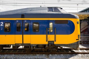 Dutch locomotive waiting at the station clipart