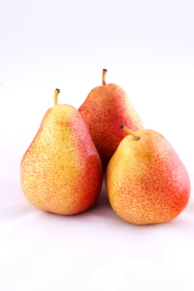 Three red pear on white background Royalty Free Stock Photos