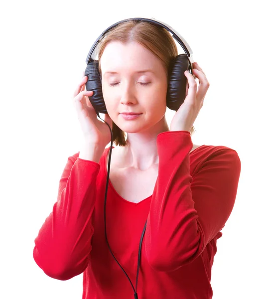 Fiatal nő fülhallgatóban Stock Kép