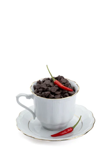 A cup with chocolate chips and chili — Stock Photo, Image