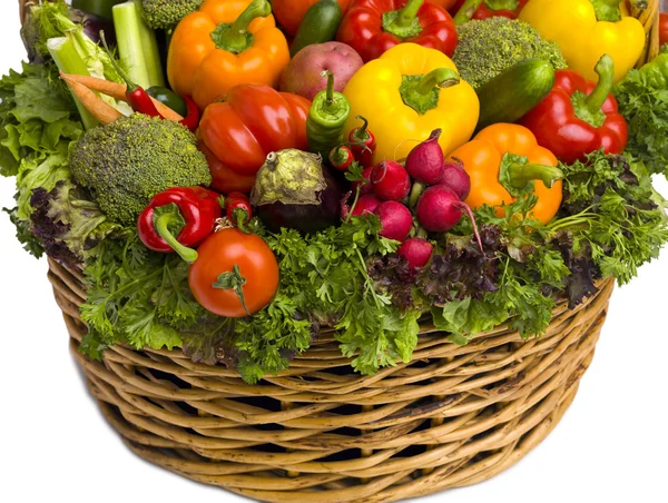 Basket overflowing with vegetables — Stock Photo, Image