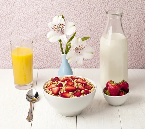 Bowl of cereals with strawberry juice and milk — Stock Photo, Image