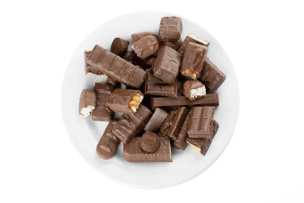 Čokoláda na bílé desce — Stock fotografie