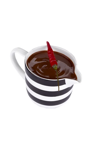 Schokoladentasse mit Chili oben — Stockfoto