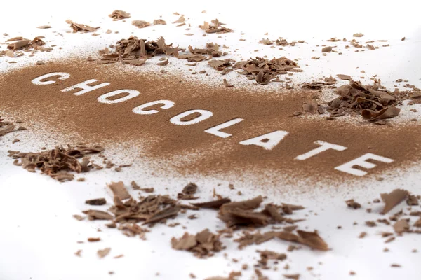 Chocolade tekst in chocolade poeder — Stockfoto