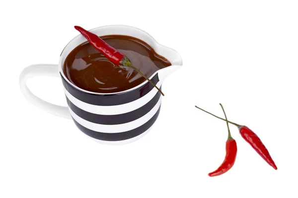 Chocolate syrup with chili pepper — Stock Photo, Image