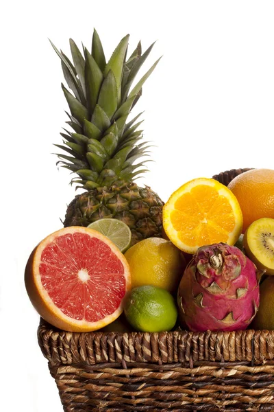 Cropped image of fruits in wicker basket — Stock Photo, Image