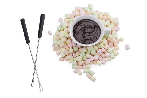 Cup of melted chocolate with marshmallows and fondue stick — Stock Photo, Image