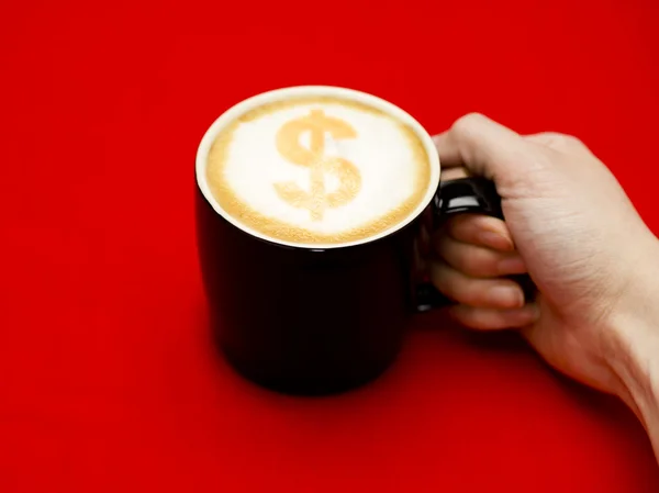 stock image Hand grabbing coffee cup with dollar sign