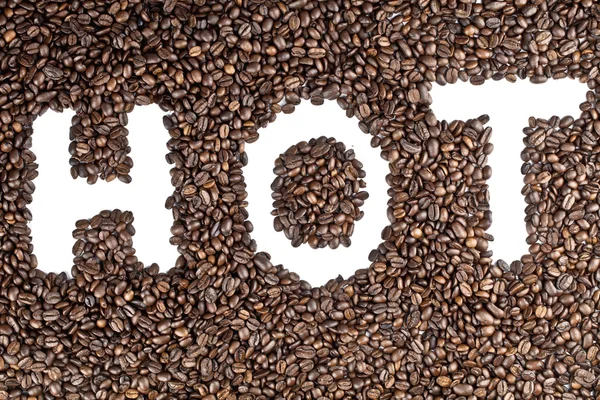 Texto quente em grãos de café — Fotografia de Stock