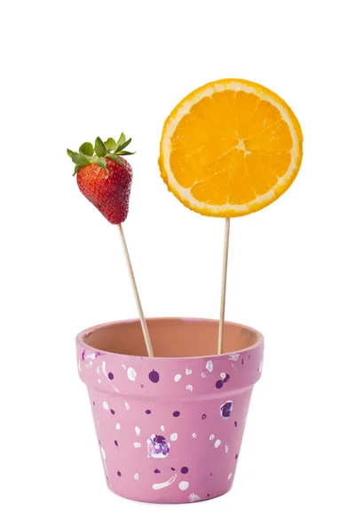 Strawberry and slice orange on stick — Stock Photo, Image