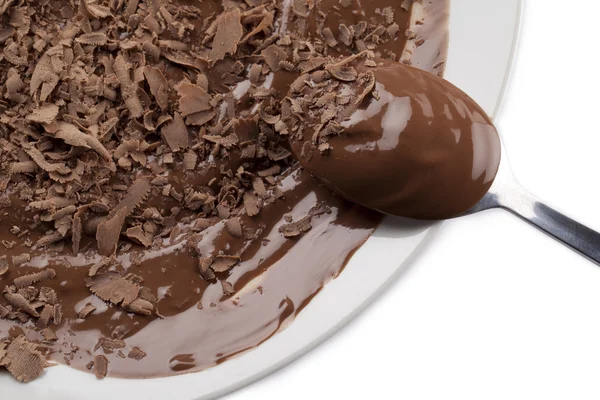 Schokoladensauce mit kleinen Stücken Schokolade lizenzfreie Stockbilder