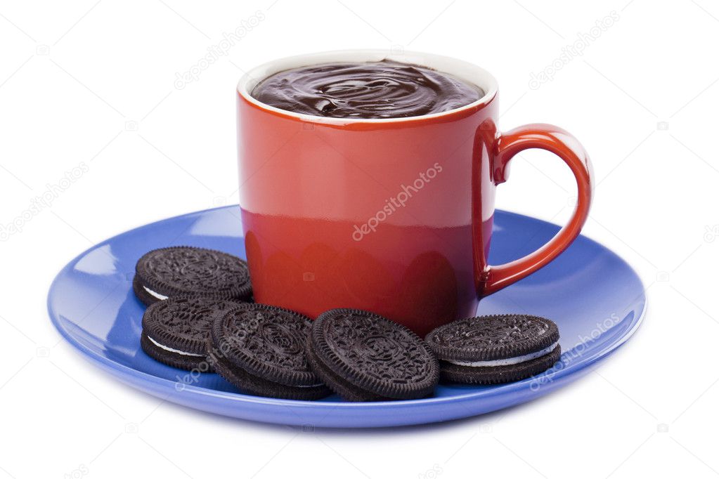 Cup of melted chocolate with chocolate cookies