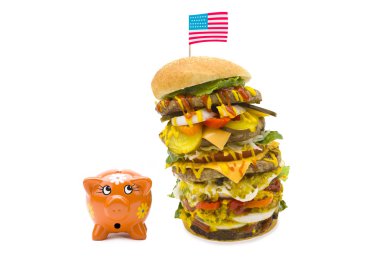 Enormous burger falling over on piggy bank clipart