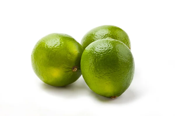 Tre limefrukter — Stockfoto