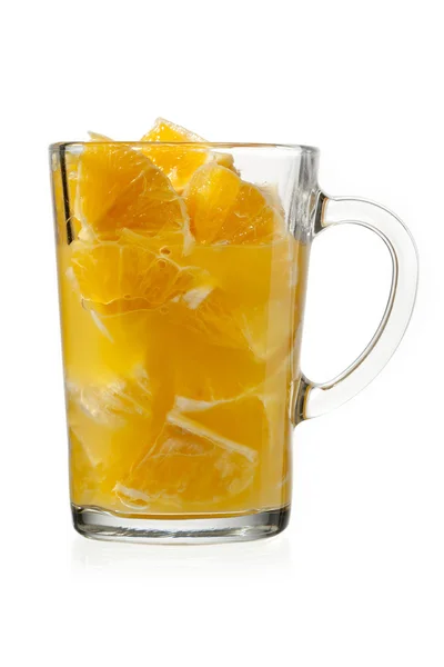 Orange pulp and juice in glass — Stock Photo, Image