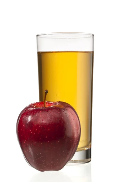 Apple beside apple juice glass — Stock Photo, Image