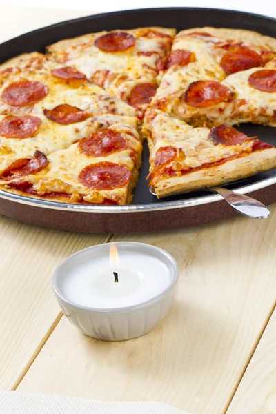 Pizza on pan with spatula — Stock Photo, Image
