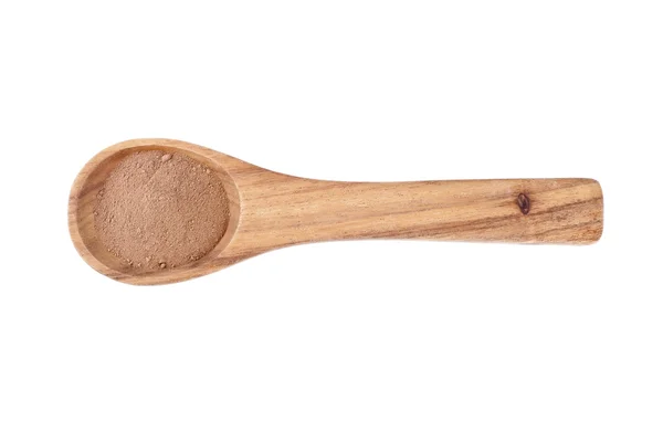 Wooden spoon with chocolate powder — Stock Photo, Image