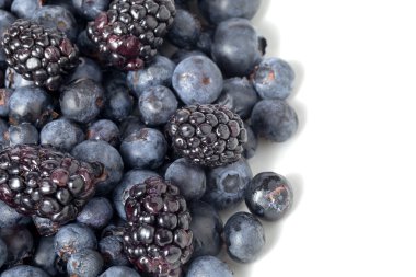 Blackberries and grapes on white